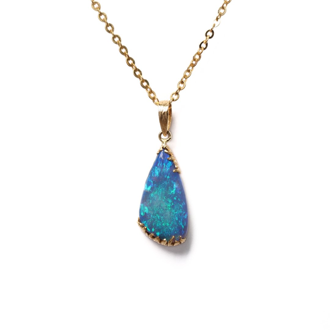 Black Opal Pendant with vivid blue colours set in yellow gold