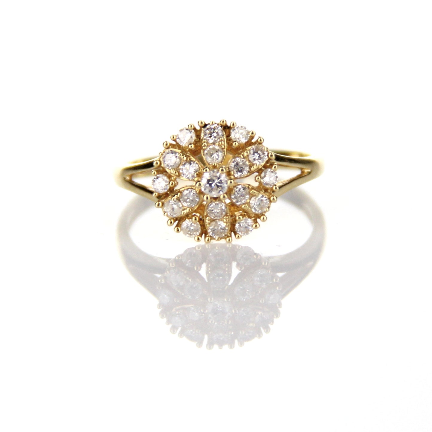 Gold ring with diamonds set in a flower petal pattern.