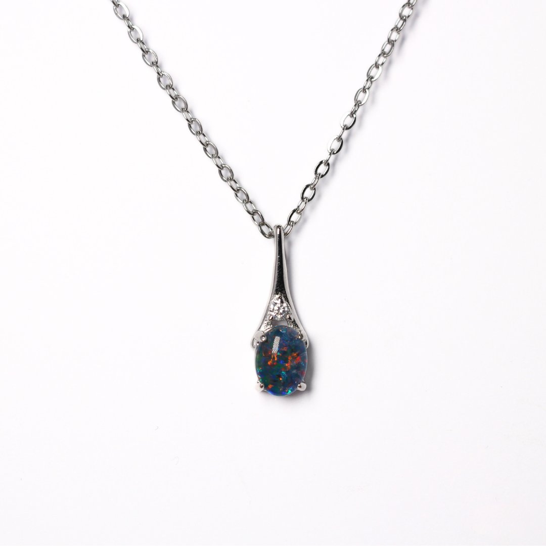 Silver pendant with a set blue opal 