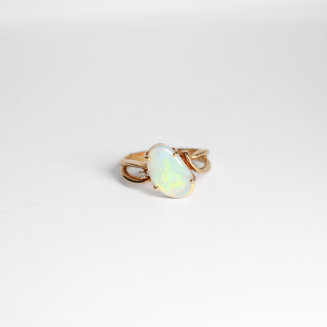 Light translucent crystal ring set in yellow gold