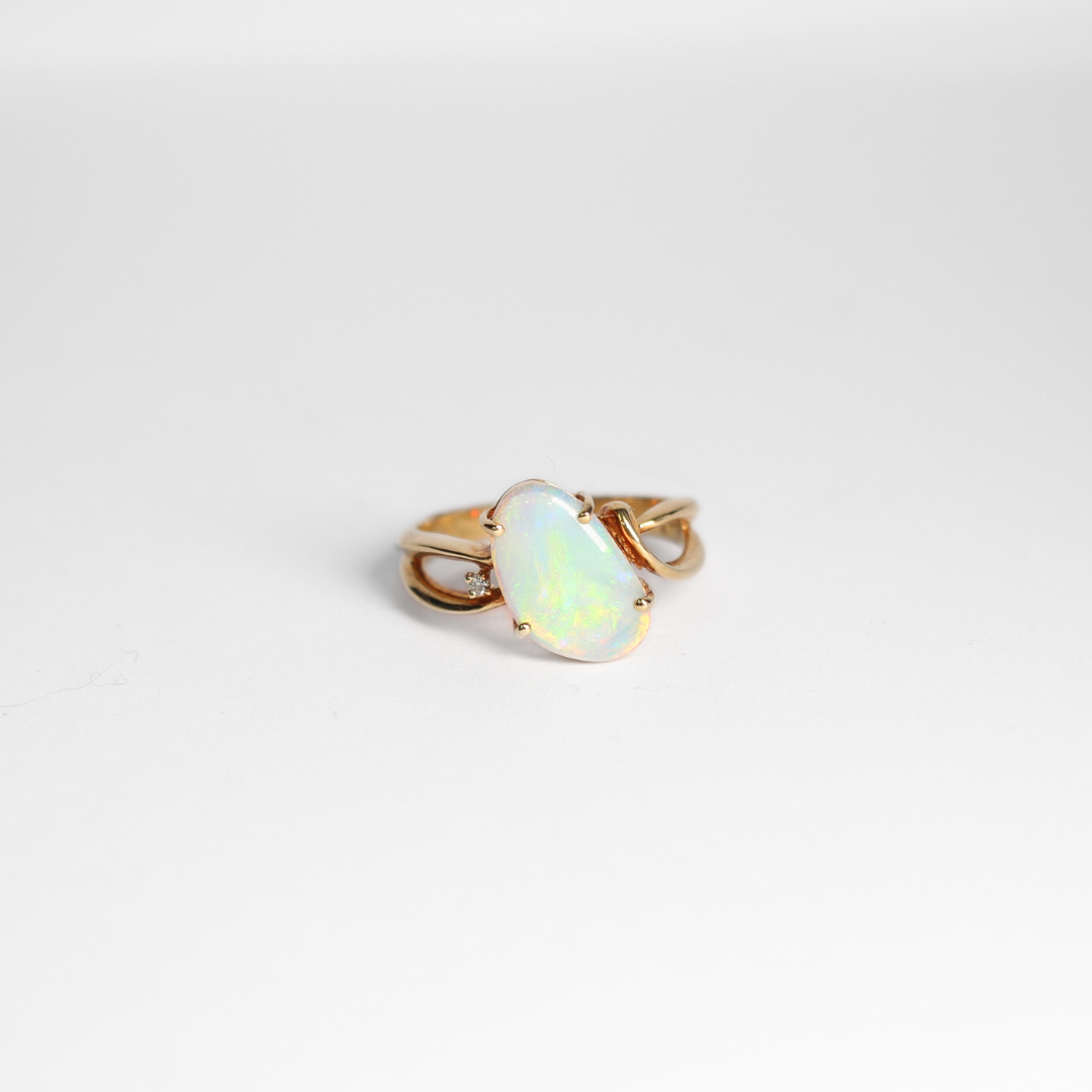 Light translucent crystal ring set in yellow gold