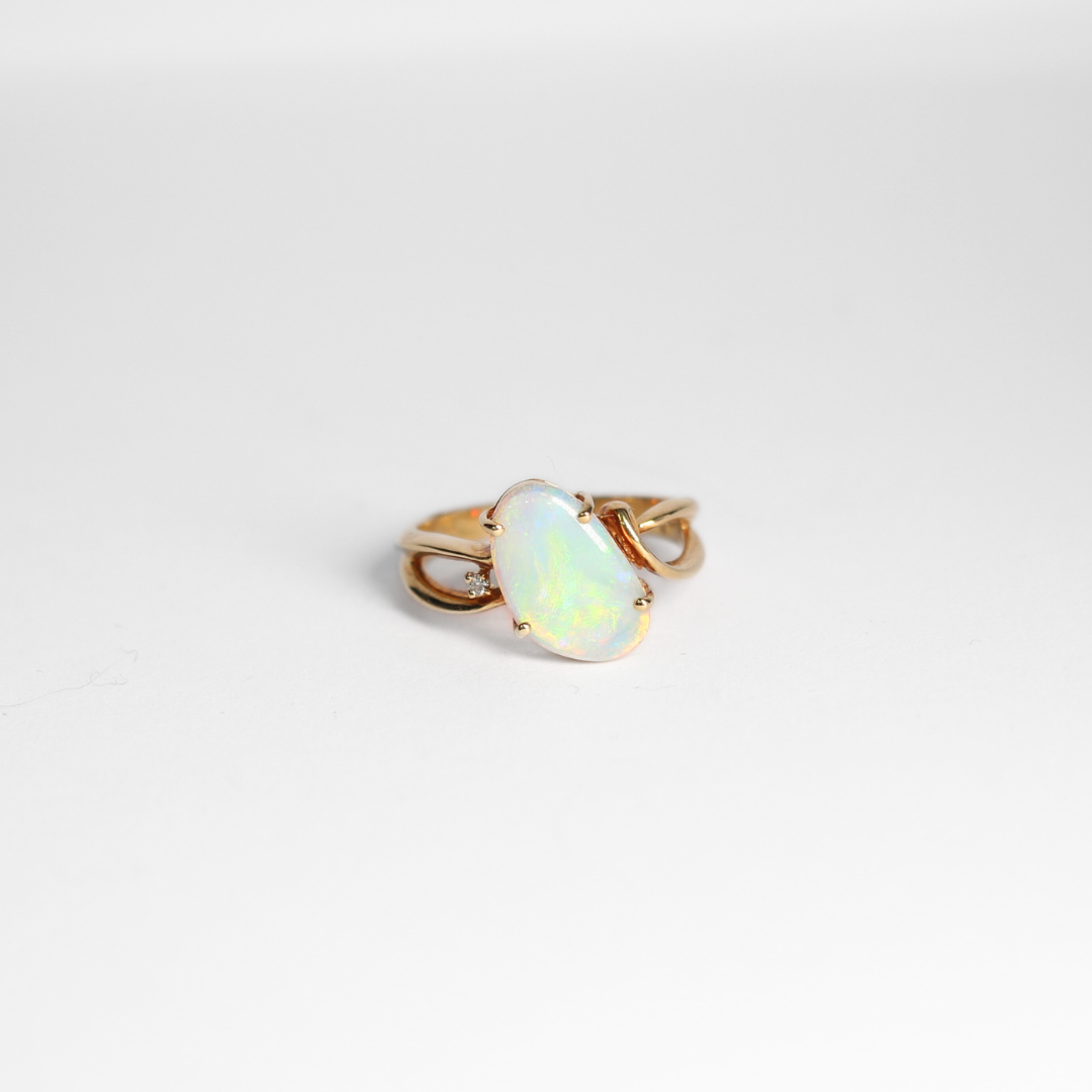 An opaque Crystal Opal Ring set in yellow gold