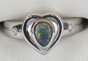 a White Gold Heart shaped ring with Triangular Black Opal and 2 Diamonds