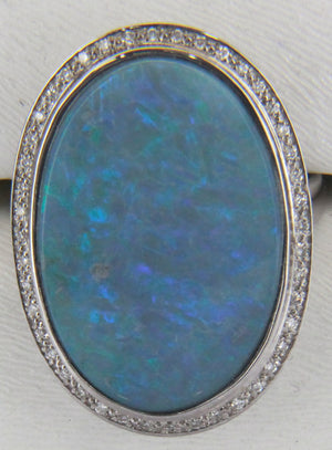 a White Gold Ring with large Black Opal and 44 Diamonds